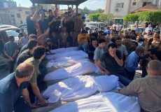 Mourners attend the funeral of Palestinians from al-Agha family