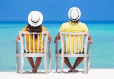 couple-relaxing-at-the-beach-1