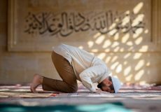 Muslim man is praying in mosque